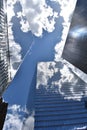 Clouds Reflect on the Building Glass Walls of the Skyscrapers in Manhattan, New York City. Royalty Free Stock Photo