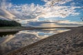 Cloud reflections on coastal lagoon Royalty Free Stock Photo