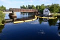 Cloud reflections and rail bridge spanning river at Bala Falls Royalty Free Stock Photo