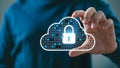 Cloud security icon with a glowing padlock inside an outlined cloud held by a hand Royalty Free Stock Photo