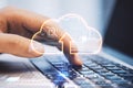 Cloud service and technologies concept with digital cloud symbol with arrow and circuit inside on human fingers typing on modern Royalty Free Stock Photo