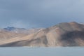 Cloud shadow on mountain range stand by lake Royalty Free Stock Photo