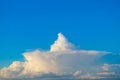Cloud in the shape of cake or boat against blue sky. Royalty Free Stock Photo