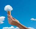 Cloud in shape of ice cream as if it placed in the cone of ice cream. Creative summer concept