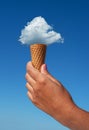 Cloud in shape of ice cream as if it placed in the cone of ice cream. Creative summer concept