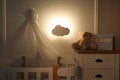 Cloud shaped night lamp in baby`s room