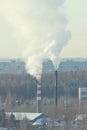 Cloud of smoke rising up from indastrial chimney