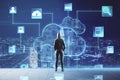 Cloud storage concept with person back in front of virtual screen with cloud application symbols on night megapolis city Royalty Free Stock Photo