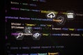 Cloud storage and data security concept over programming code background, featuring icons for upload, protection, and digital Royalty Free Stock Photo