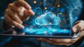 Cloud storage service concept. A person holds a tablet PC with an array of online services on it. He touches the cloud Royalty Free Stock Photo