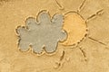 Cloud and sun drawing in sand Royalty Free Stock Photo