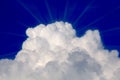 Cloud with Sun Rays in Blue Sky Royalty Free Stock Photo