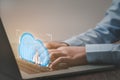 Cloud technology. The human hand uses a laptop with cloud-interface computing technology and online data storage for business Royalty Free Stock Photo
