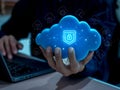 Cloud technology security concept with hand holding glowing secure icon on 3d blue cloud, showing data protection, digital privacy Royalty Free Stock Photo