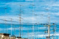 Cloud of television antena in the blue sky. Royalty Free Stock Photo