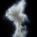 A cloud of white powder exploding against a black background Royalty Free Stock Photo