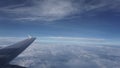 Cloud and wing at the aircraft window