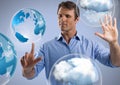Cloud world bubbles and Businessman touching air with eyes closed in front of windows Royalty Free Stock Photo