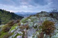 Clouded sunset on rosky mountain