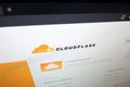 The Cloudflare logo and website interface displayed on a computer screen. Royalty Free Stock Photo