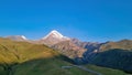 Gergeti Glacier - A cloudless view on Mount Kazbeg in Caucasus, Georgia. There slopes are barren and stony Royalty Free Stock Photo