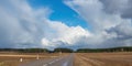 Clouds above the road, spring roads. Royalty Free Stock Photo