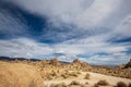 Clouds above rock formation in Alabama Hills of Sierra Nevada mountain in California Royalty Free Stock Photo