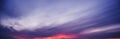 Clouds against a background of purple cloudy dramatic sky at sunset in evening. Panorama of the sky Royalty Free Stock Photo