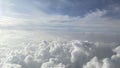 Clouds against the blue sky from the airplane window Royalty Free Stock Photo