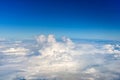 Clouds against blue sky view through an airplane window for a background Royalty Free Stock Photo