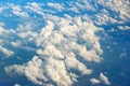 Clouds against blue sky view through an airplane window for a background Royalty Free Stock Photo