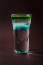 Clouds Alcoholic shot glass with absent, sambuca, tequila, blue Royalty Free Stock Photo