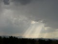 clouds announcing storm, rays of light between clouds 3