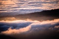 Clouds bathed in the sunset light covering rolling hills, south San Francisco bay area, California Royalty Free Stock Photo