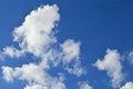 Soft white clouds in a brilliant blue sky Royalty Free Stock Photo