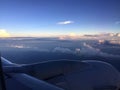 Clouds and blue sky behind the window of aircraft Royalty Free Stock Photo