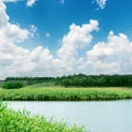 Clouds in blue sky over river Royalty Free Stock Photo