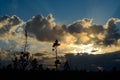 Clouds in blue sky over the silhouette of pine forest at sunset Royalty Free Stock Photo