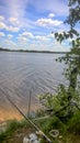 Clouds on a blue sky on a river in the forest