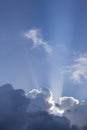 Clouds on a blue sky with Sun light rays or beams bursting. Spiritual religious concept background Royalty Free Stock Photo