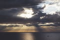 Clouds blue sky and sunlight sunset on horizon ocean . ÃÂ¡loudscape on background seascape dramatic atmosphere rays sunrise