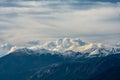 Clouds Brew Over Snow Capped Mountains in Colorado Royalty Free Stock Photo