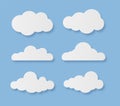 Clouds. Cartoon rainy sky elements with shadows. White paper cut decorative cloudy forms. Fluffy shapes on blue