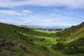 Clouds cast shadow down on Hollyrood park valley