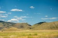 Clouds Cast Shadows On The HIlls Outside Gardiner Montana