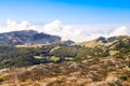 Clouds cover peak mountains in National park Lovcen. Beautiful Montenegro in autumn