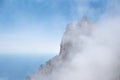 Clouds cover the rocky summit. Rocky Mountains Royalty Free Stock Photo