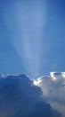 Summer, cloud-covered sunlight produces a glimmer of light in a silver cloud Royalty Free Stock Photo