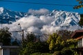 clouds covering the majestic snow covered Andes mountain range from the door of a house in santiago de chile Royalty Free Stock Photo