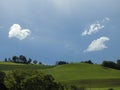 Clouds dance over hills